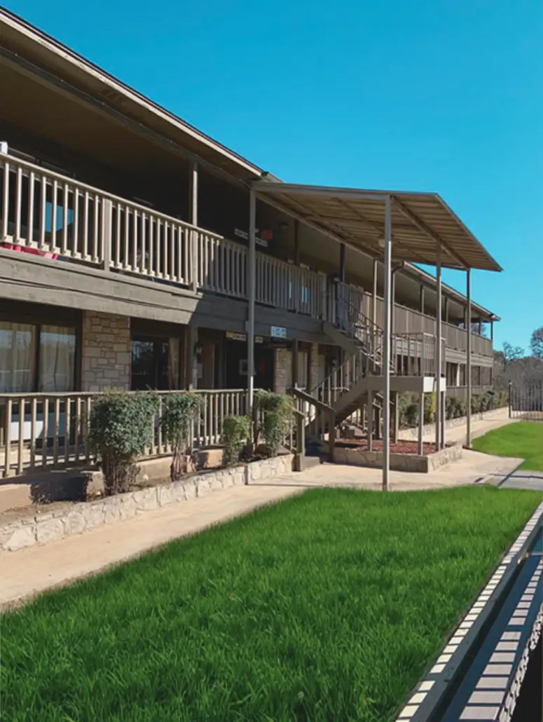 Two-story sober living residence with balcony walkway in Arlington