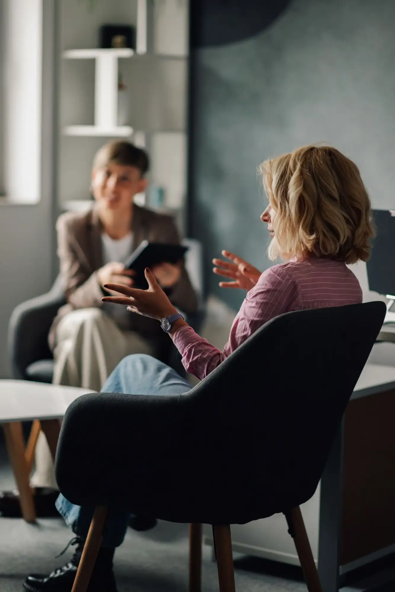 Group therapy conversation in a modern lounge