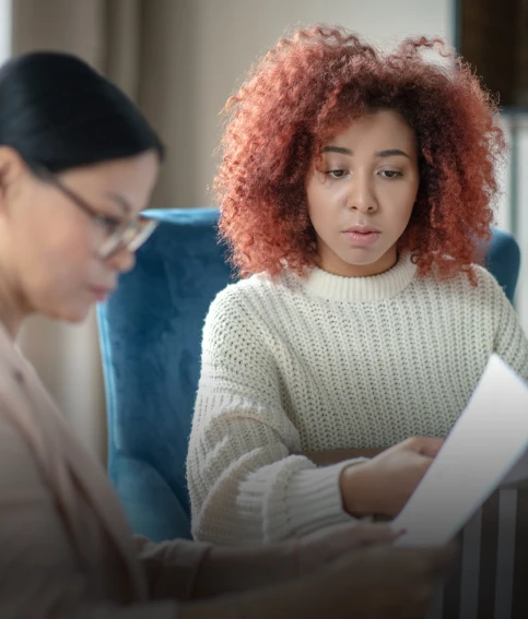 Counselor reviewing documents with a young woman