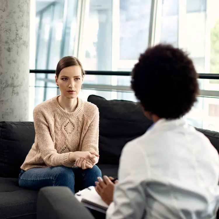Young woman talking with a counselor one-on-one
