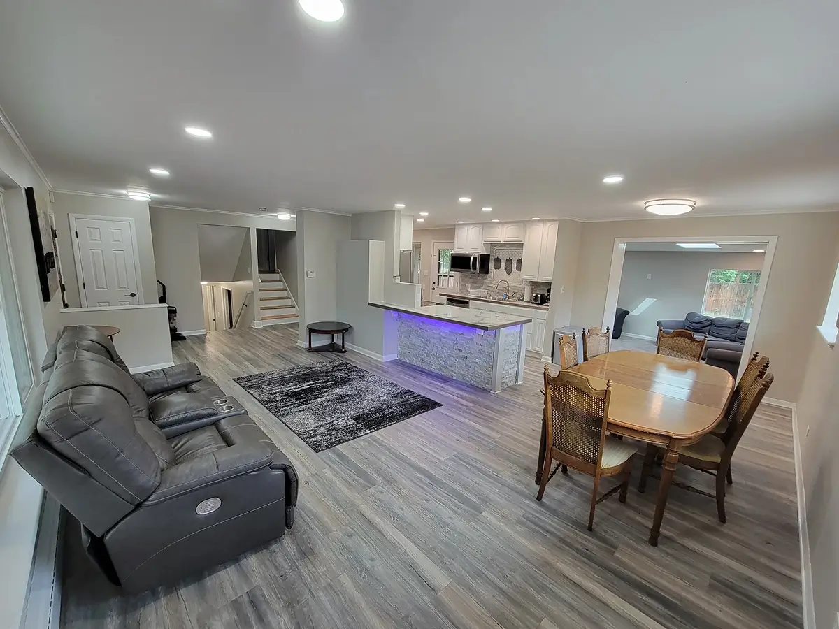 Open-plan living room and kitchen inside a sober living home