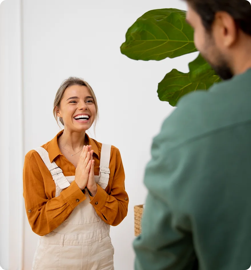 Woman laughing during a friendly conversation