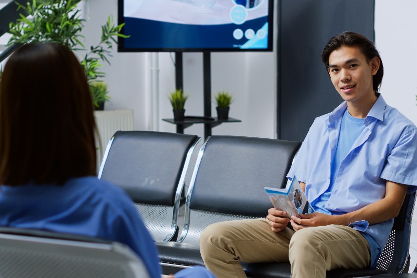 Young adult sitting on chair