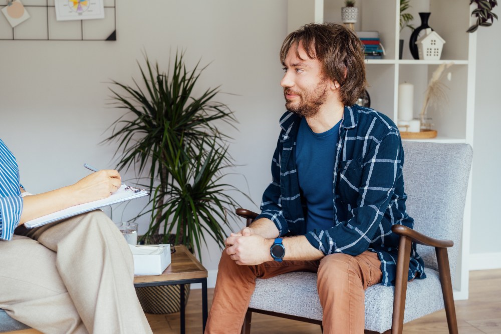 patient having psychotherapy session with counselor