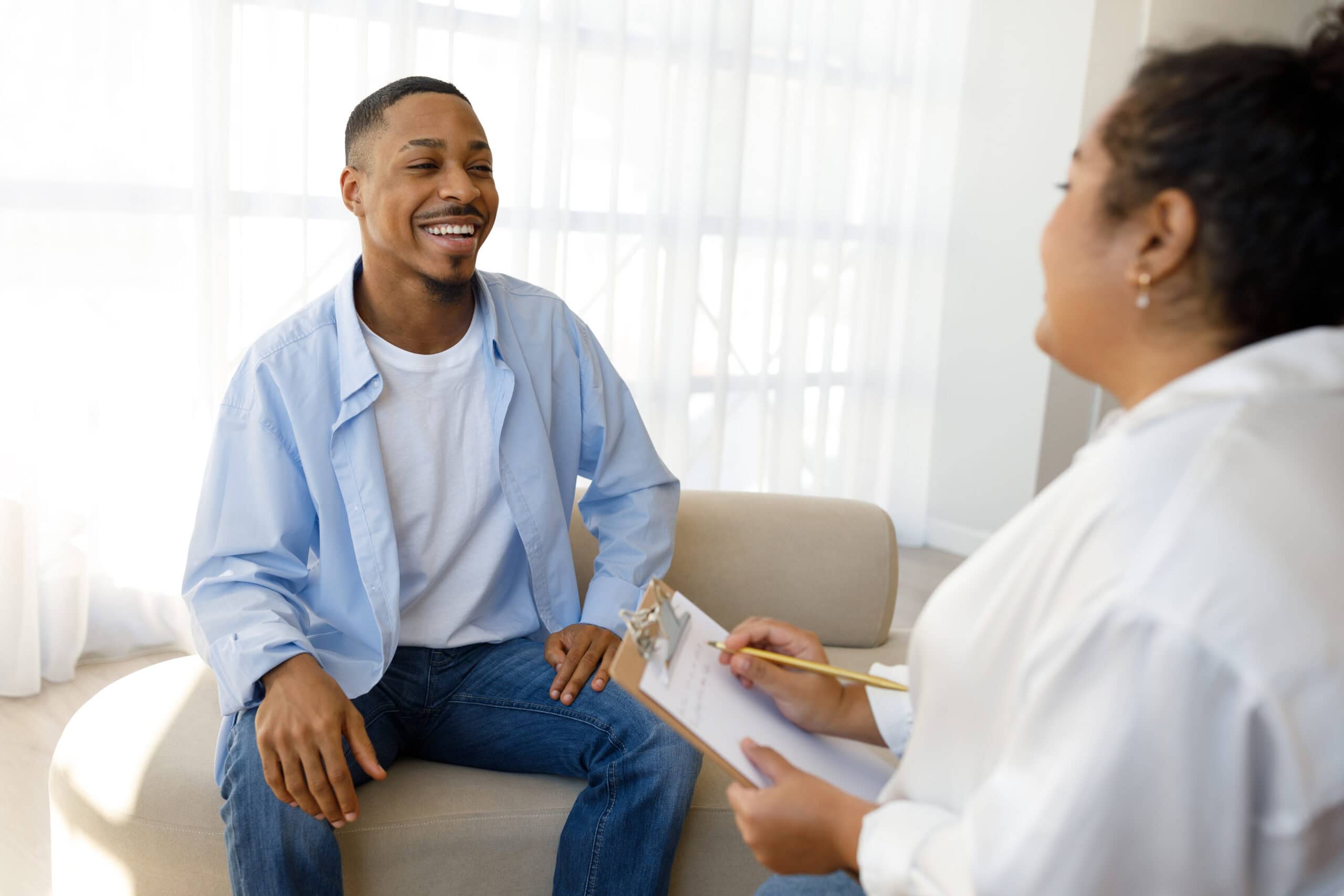 A man talking with a doctor in a detox san antonio program.